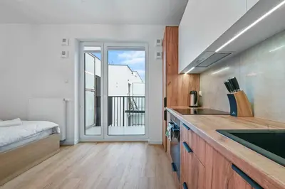 Łóżko lub łóżka w pokoju w obiekcie Stylish studio. Free parking.