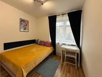 Łóżko lub łóżka w pokoju w obiekcie Smooth Life Apartment