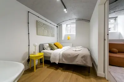 Łóżko lub łóżka w pokoju w obiekcie Warsaw Concierge Mińska Loft