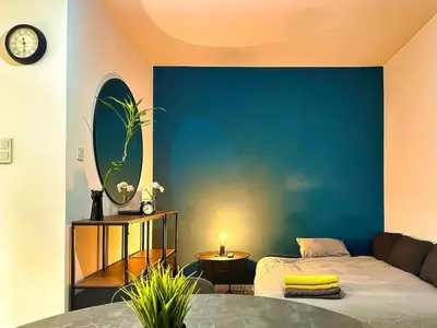 Łóżko lub łóżka w pokoju w obiekcie Klimatyczna Hotelowa Kawalerka