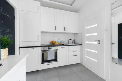 Kuchnia lub aneks kuchenny w obiekcie Marszałkowska 83 - Stacja metra 500m - Dworzec centrlany 1km - Better rental