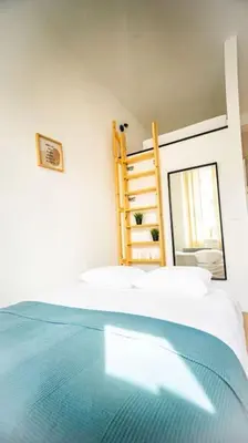 Łóżko lub łóżka w pokoju w obiekcie Stylish apartment in Warsaw