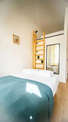 Łóżko lub łóżka w pokoju w obiekcie Stylish apartment in Warsaw