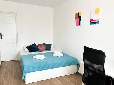 Łóżko lub łóżka w pokoju w obiekcie Next Life Apartament