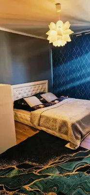 Łóżko lub łóżka w pokoju w obiekcie Green Apartment