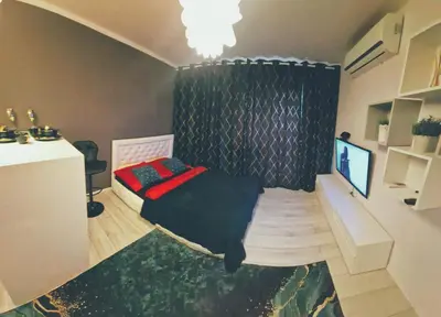 Telewizja i/lub zestaw kina domowego w obiekcie Green Apartment