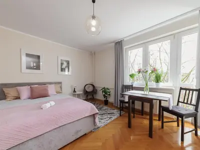 Łóżko lub łóżka w pokoju w obiekcie Cardamon Apartment City Center