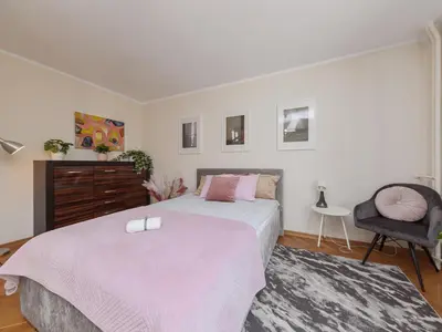 Łóżko lub łóżka w pokoju w obiekcie Cardamon Apartment City Center
