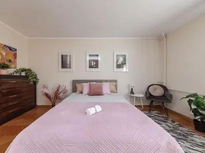 Łóżko lub łóżka w pokoju w obiekcie Cardamon Apartment City Center