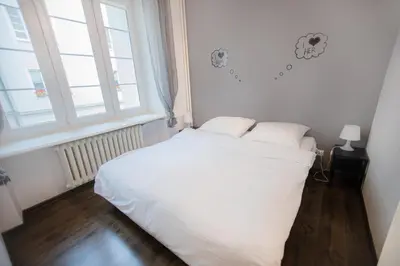 Łóżko lub łóżka w pokoju w obiekcie Poznanska Apartment. Great location. City Center