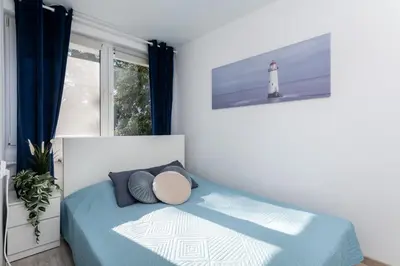 Łóżko lub łóżka w pokoju w obiekcie Cupcake Apartment Mokotow