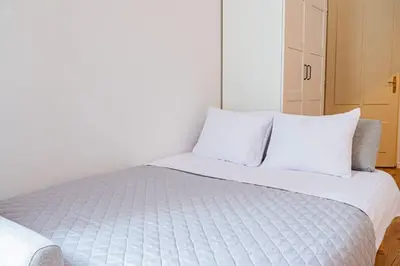 Łóżko lub łóżka w pokoju w obiekcie Komfortowy Apartament w Centrum