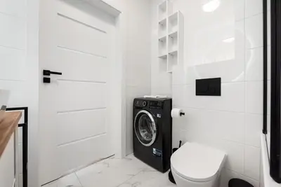 Łazienka w obiekcie Brzeziny Deluxe Apartment by BookingHost
