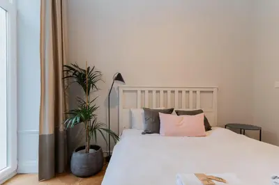 Łóżko lub łóżka w pokoju w obiekcie Warsaw Concierge Gagarina Garden