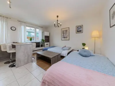 Łóżko lub łóżka w pokoju w obiekcie Sugar Plum Apartment Bielany