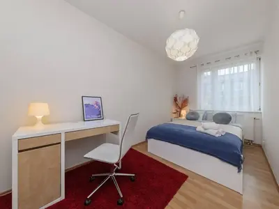 Łóżko lub łóżka w pokoju w obiekcie Sugar Plum Apartment Bielany