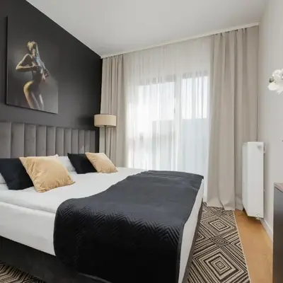 Cozy Apartment with Air Conditioner and Parking by Noclegi Renters