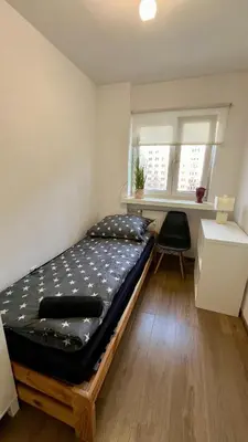 Łóżko lub łóżka w pokoju w obiekcie Rooms In Warsaw - C106B