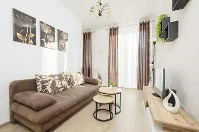 Telewizja i/lub zestaw kina domowego w obiekcie Cozy & Comfortable Apartment Grodeckiego by Noclegi Renters