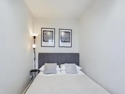 Łóżko lub łóżka w pokoju w obiekcie Modern Studio with WiFi in Warsaw by Noclegi Renters