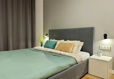 Łóżko lub łóżka w pokoju w obiekcie K22 Expo XXI Sławińska 6 501