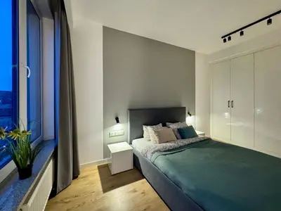 Łóżko lub łóżka w pokoju w obiekcie K22 Expo XXI Sławińska 6 501