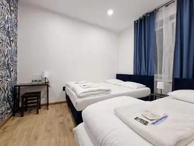 Łóżko lub łóżka w pokoju w obiekcie Apart HoStel Helvetia B&B