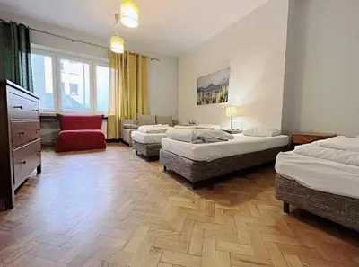 Łóżko lub łóżka w pokoju w obiekcie Apart HoStel Helvetia B&B
