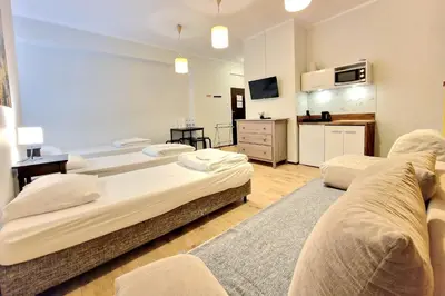 Łóżko lub łóżka w pokoju w obiekcie Apart HoStel Helvetia B&B