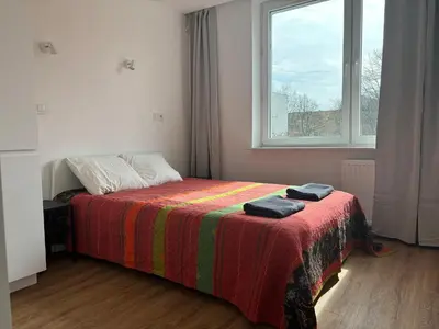 Łóżko lub łóżka w pokoju w obiekcie Olo Apartment