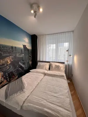 Łóżko lub łóżka w pokoju w obiekcie Mià Warsaw - Królewska