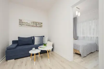 Łóżko lub łóżka w pokoju w obiekcie Bright Apartment in Warsaw Center with Two Bedrooms and Balcony by Noclegi Renters