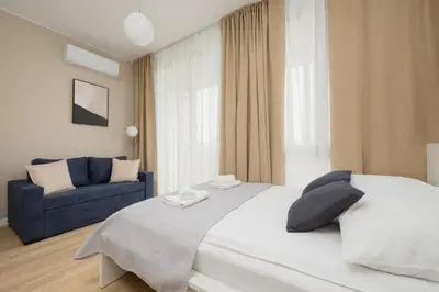 Łóżko lub łóżka w pokoju w obiekcie Sarmacka 27 studio 2 - Medicover/Paley
