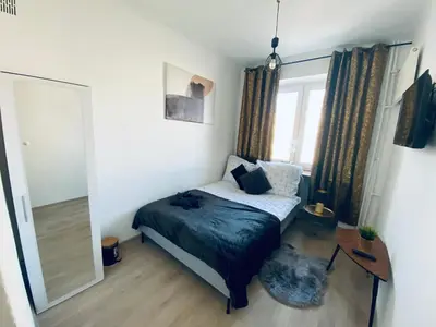 Łóżko lub łóżka w pokoju w obiekcie ClickTheFlat Plac Bankowy Apart Rooms