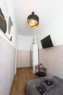 Telewizja i/lub zestaw kina domowego w obiekcie ClickTheFlat Wolska Apart Rooms