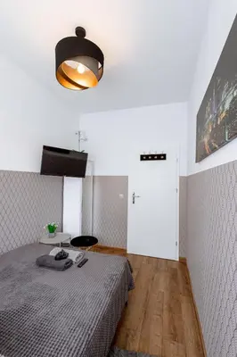Łóżko lub łóżka w pokoju w obiekcie ClickTheFlat Wolska Apart Rooms