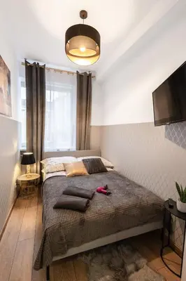 Łóżko lub łóżka w pokoju w obiekcie ClickTheFlat Wolska Apart Rooms