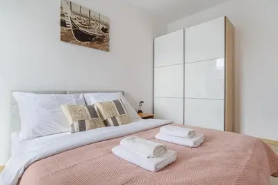 Łóżko lub łóżka w pokoju w obiekcie P&O Apartments Rydygiera III