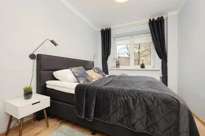 Łóżko lub łóżka w pokoju w obiekcie Family Unique Apartment for 4 people in Warsaw Wola by Noclegi Renters