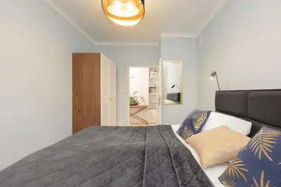 Łóżko lub łóżka w pokoju w obiekcie Family Unique Apartment for 4 people in Warsaw Wola by Noclegi Renters