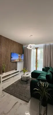 Telewizja i/lub zestaw kina domowego w obiekcie Apart Wola