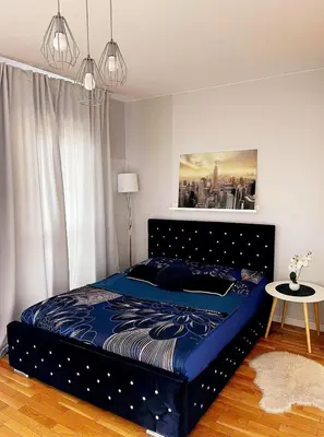 Łóżko lub łóżka w pokoju w obiekcie HomeComfort Apartament DeLux