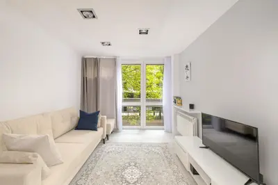 Telewizja i/lub zestaw kina domowego w obiekcie Modern Apartment in Warsaw City Center