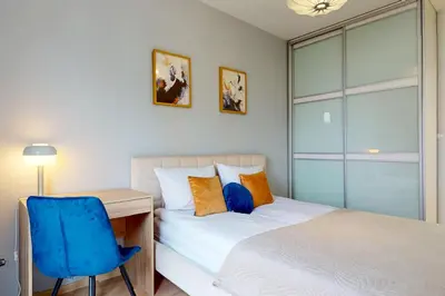 Łóżko lub łóżka w pokoju w obiekcie Grapefruit Apartment Ursus Balcony&Parking