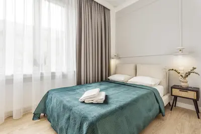 Łóżko lub łóżka w pokoju w obiekcie BlueBerry Apartment