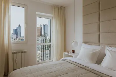 Łóżko lub łóżka w pokoju w obiekcie I LOVE WARSAW apartments
