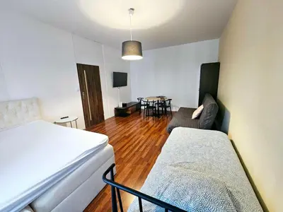 Część wypoczynkowa w obiekcie Rooms Green Rydygiera 17 own room tv wifi
