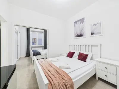 Łóżko lub łóżka w pokoju w obiekcie SuperApart Podwale 9 Unique, Step into Tranquility and Relaxation