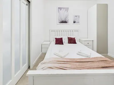 Łóżko lub łóżka w pokoju w obiekcie SuperApart Podwale 9 Unique, Step into Tranquility and Relaxation