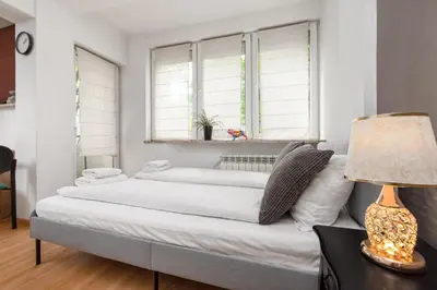 Łóżko lub łóżka w pokoju w obiekcie Niska 12 by Homeprime
